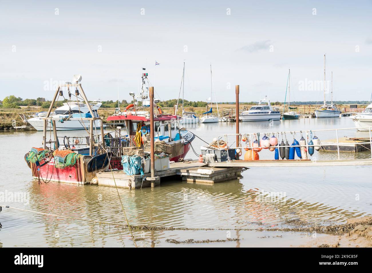 Fishing boat moored to floating jetty Southwold harbour, Suffolk 2022 Stock Photo