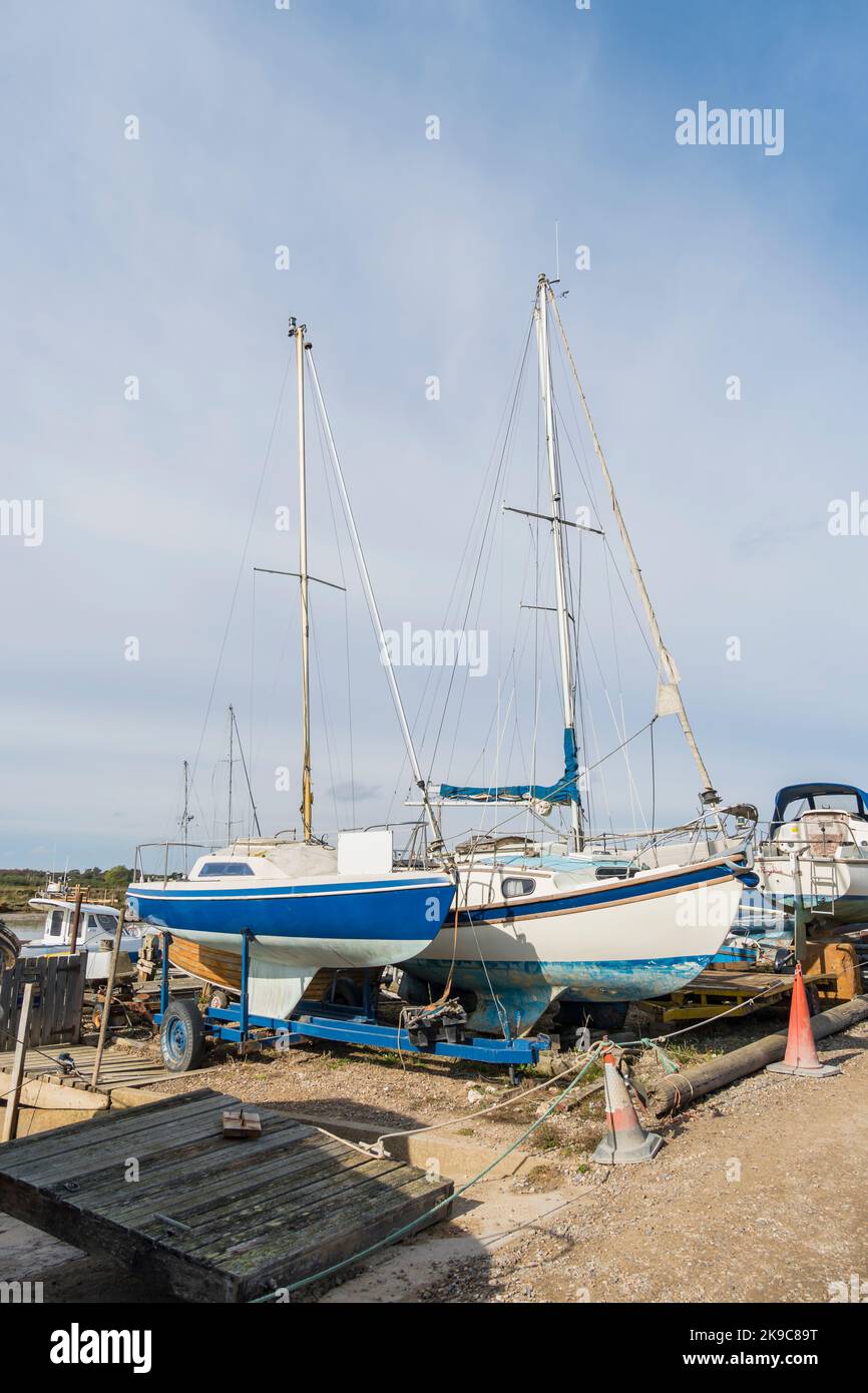Little and Large yachts sat on quayside Southwold harbour, suffolk 2022 Stock Photo