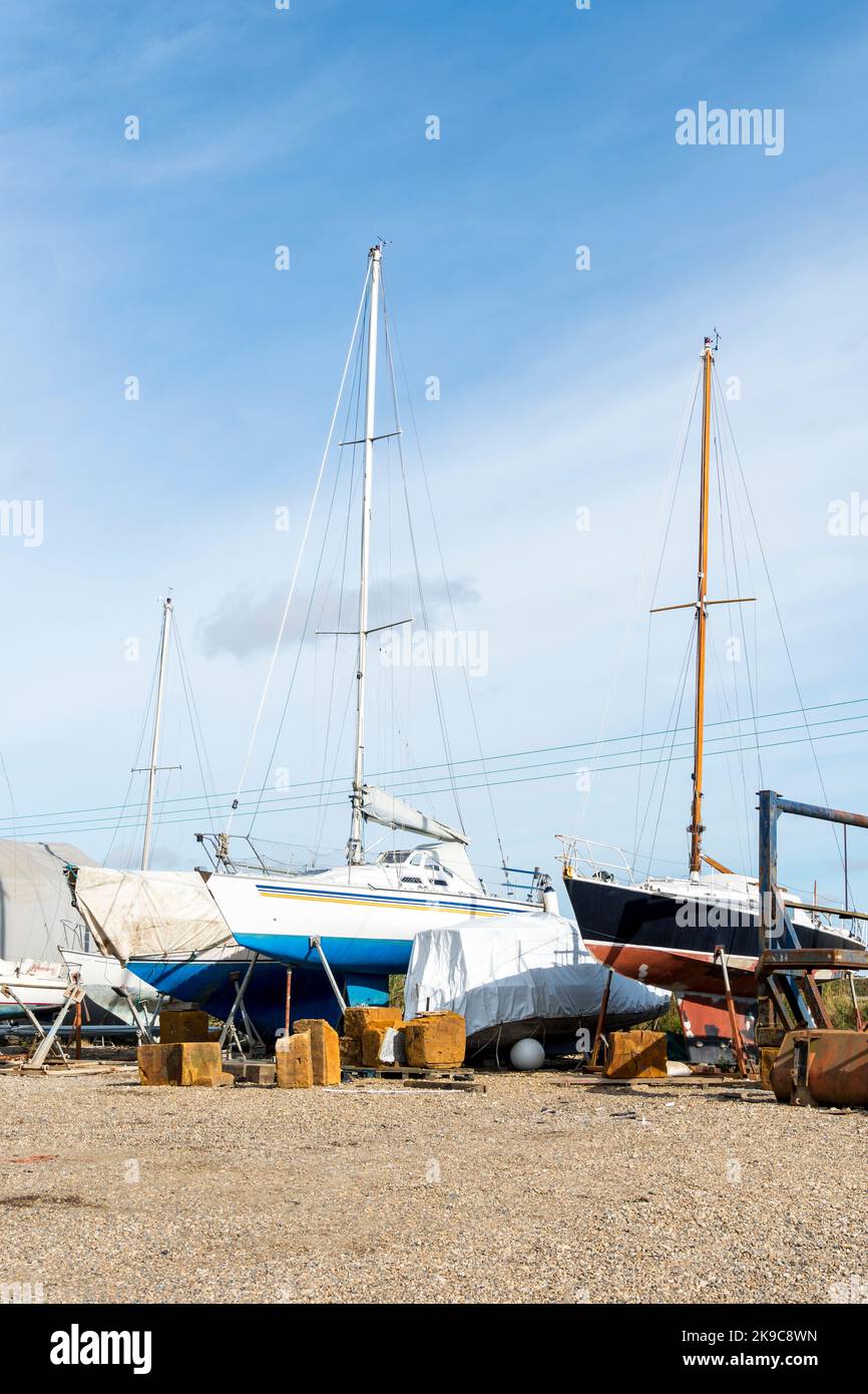 Yachts on stocks in boat yard Southwold Harbour, Suffolk 2022 Stock Photo
