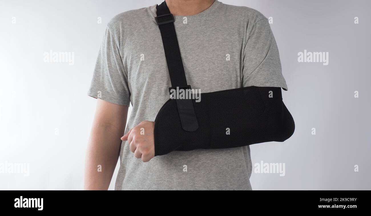 Broken arm. Arm Sling therapy support and covered around elbow first