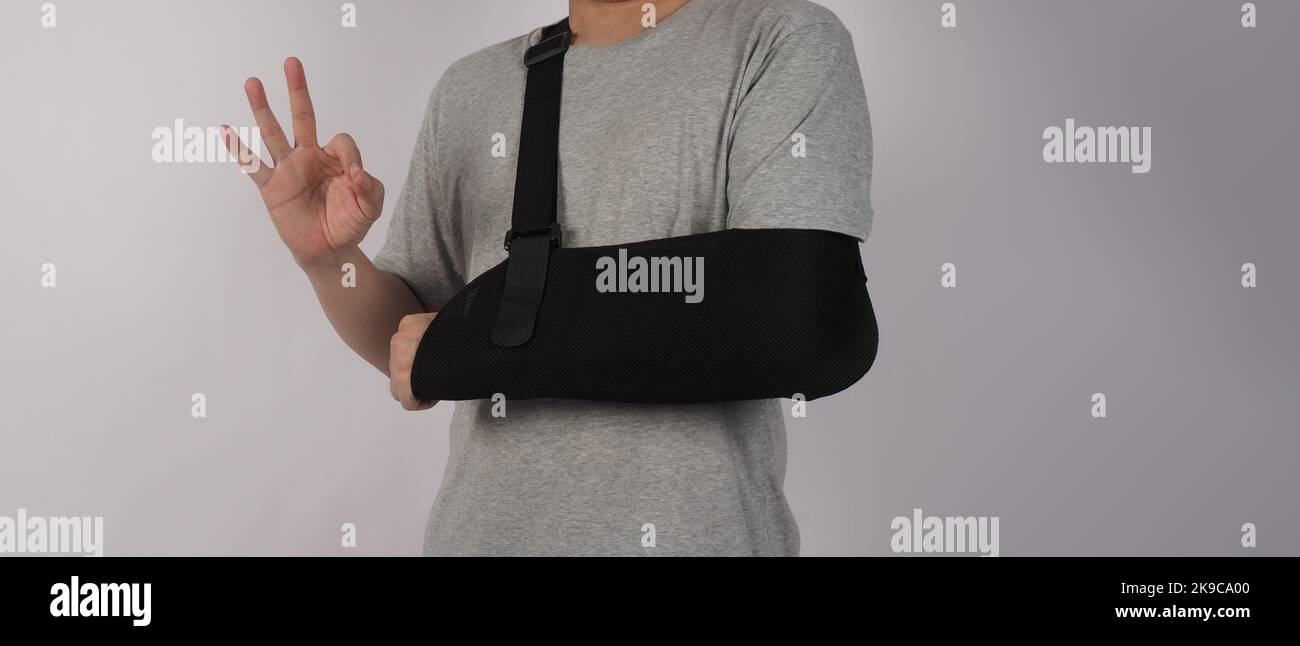 Broken arm. Arm Sling therapy support and covered around elbow first