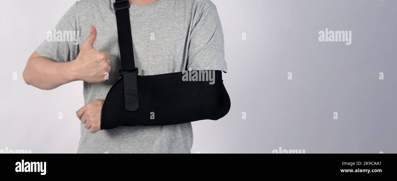 Broken arm. Arm Sling therapy support and covered around elbow first