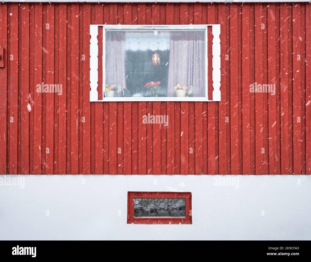 Exterior of red hardwood wall and window frame of fishing nordic house