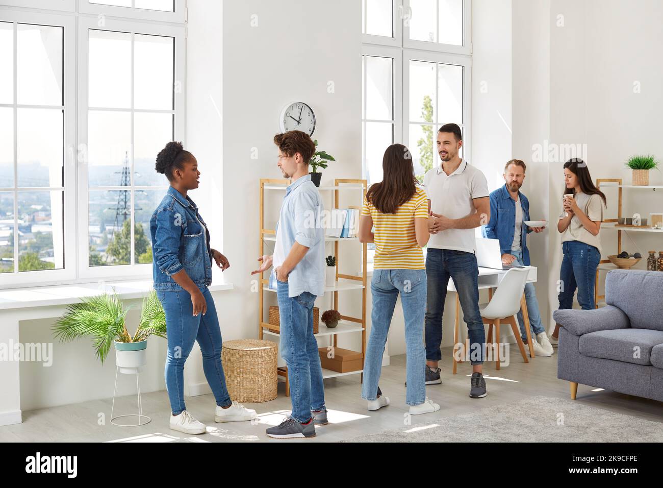 Group of multiracial friends meeting, hanging out and discussing something together Stock Photo