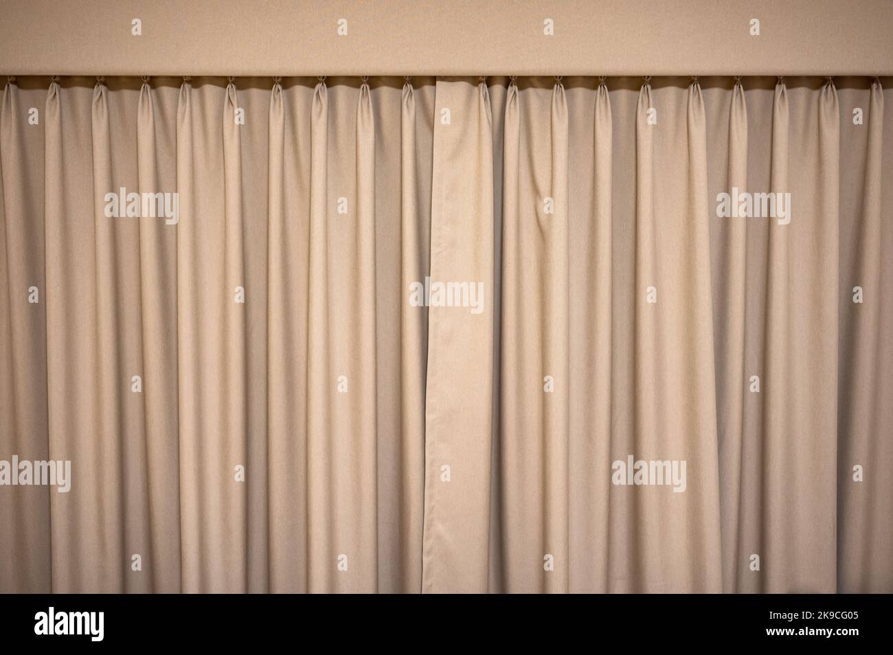 Closed brown velvet curtain wavy background Stock Photo