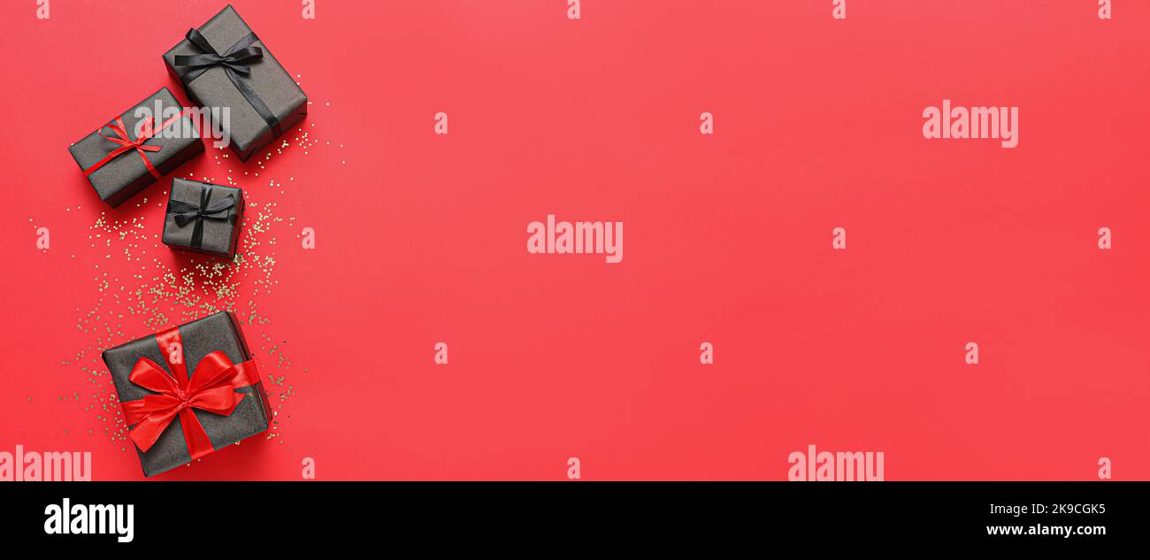 Different gift boxes on red background with space for text Stock Photo ...