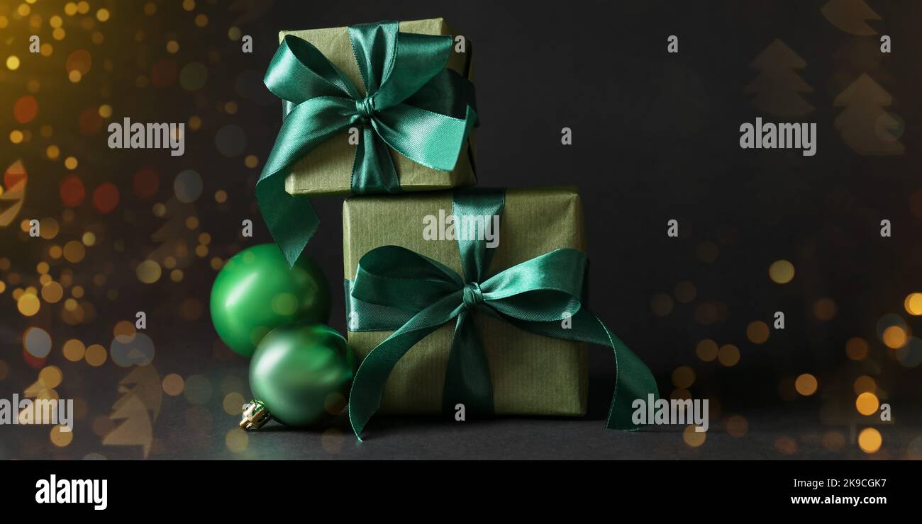 Beautiful Christmas gift boxes and balls on black background Stock ...
