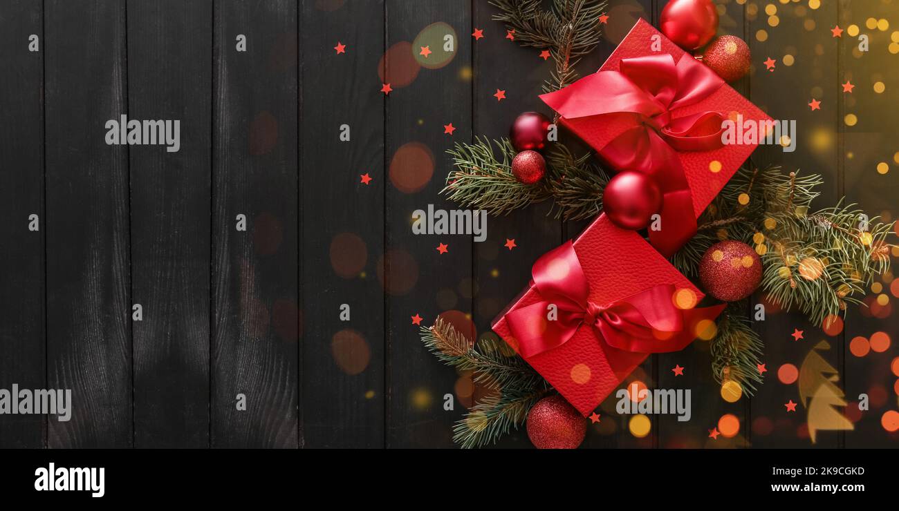 Beautiful composition with Christmas gift boxes, fir branches and balls ...