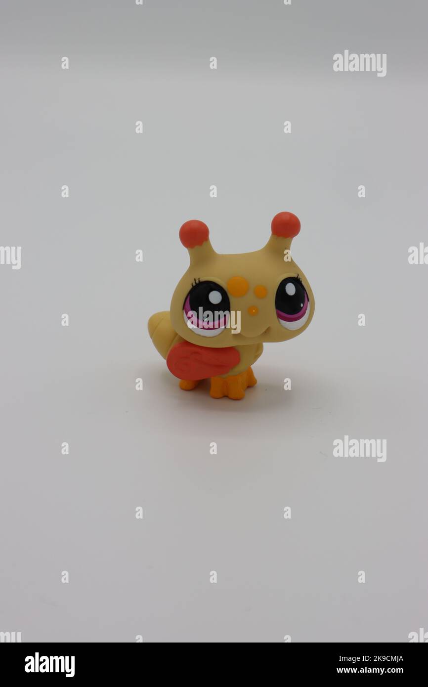 https://c8.alamy.com/comp/2K9CMJA/tiny-cute-plastic-bee-animal-figure-on-a-white-background-collectible-isolated-littlest-pet-shop-figure-with-big-head-and-big-eyes-2K9CMJA.jpg