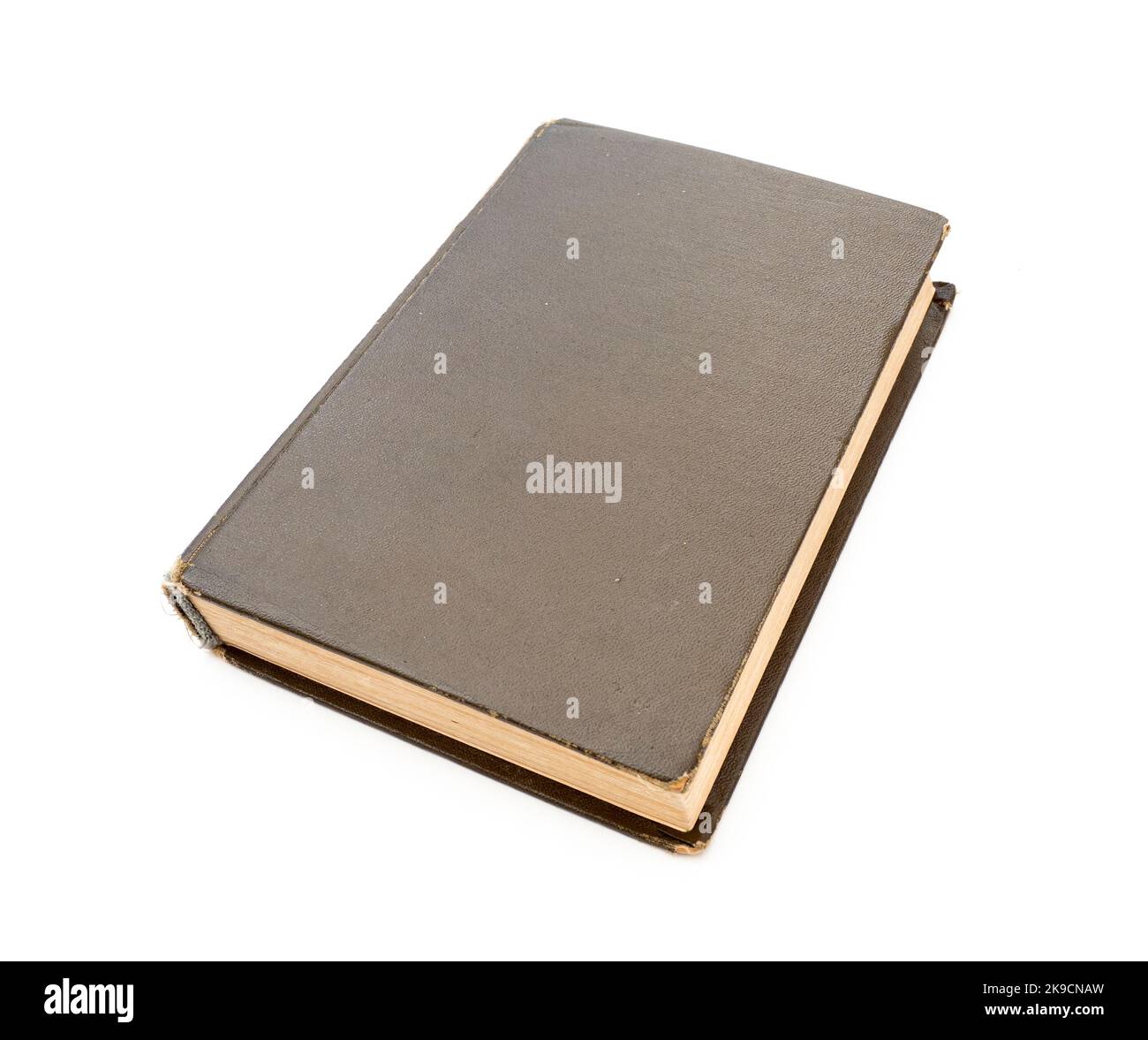 Closed brown vintage book with hard cardboard cover isolated on white