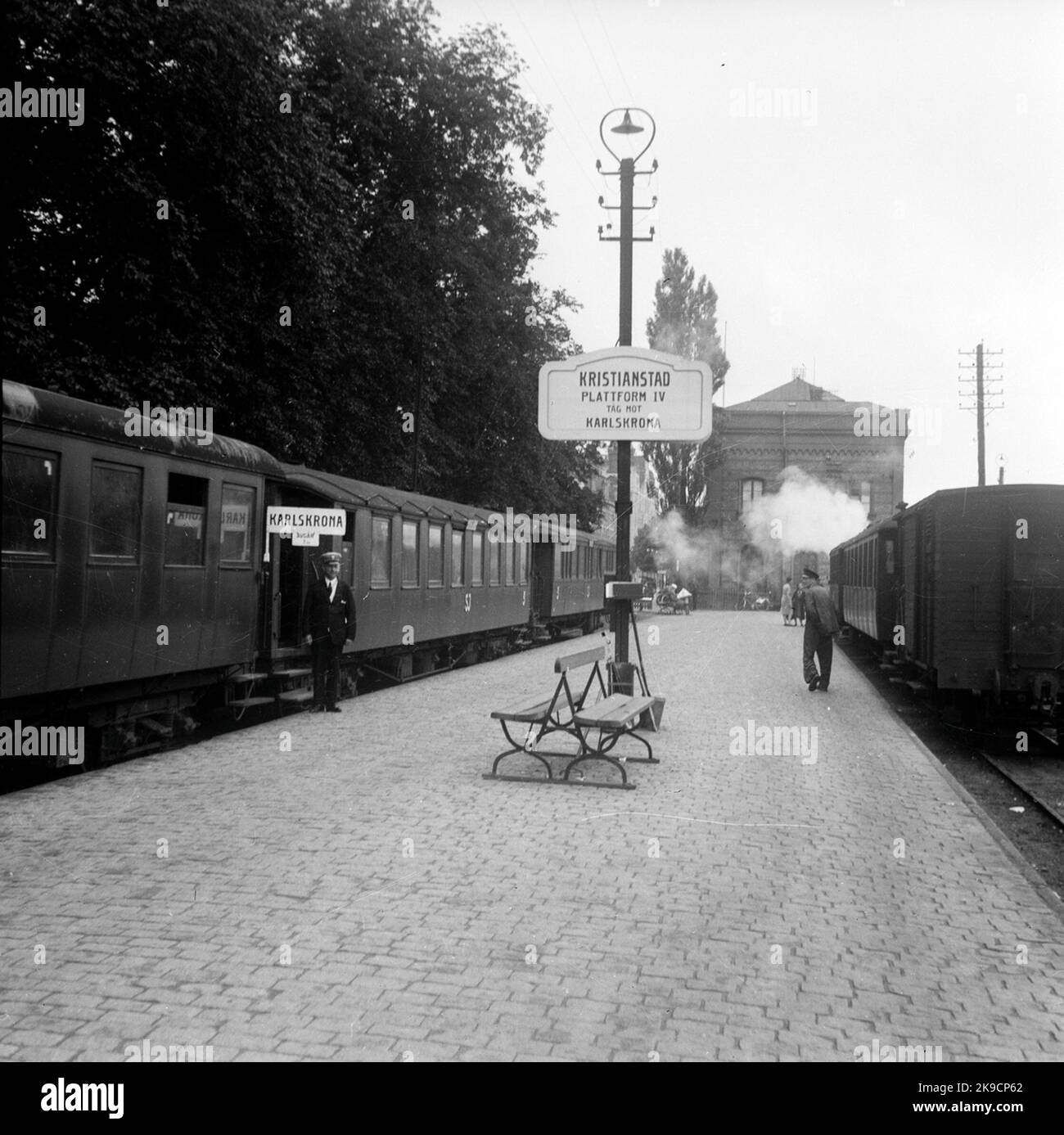 The station was built in 1865. Sign with the text: Platform IV. Train ...