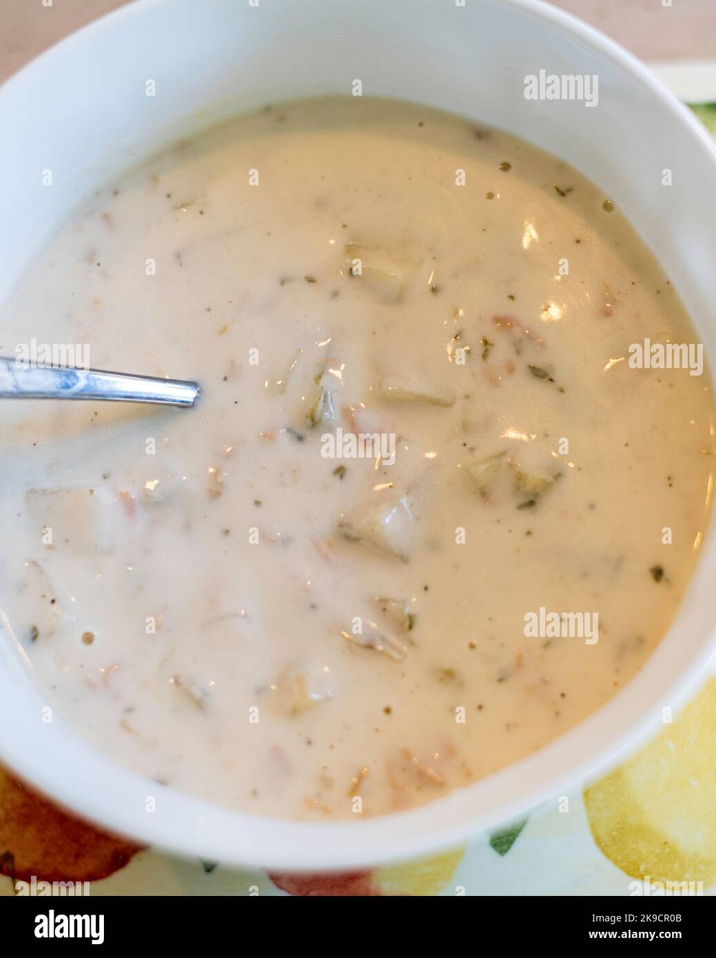 Clam chowder closeup in a white bowl with a spoon. USA Stock Photo