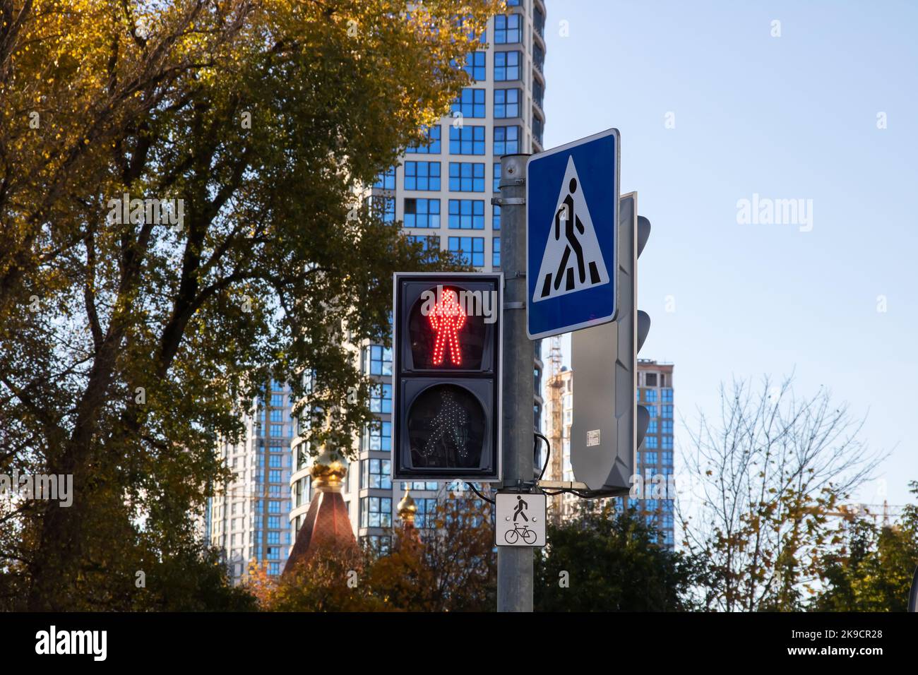 Red traffic light for pedestrians close up in autumn Stock Photo - Alamy