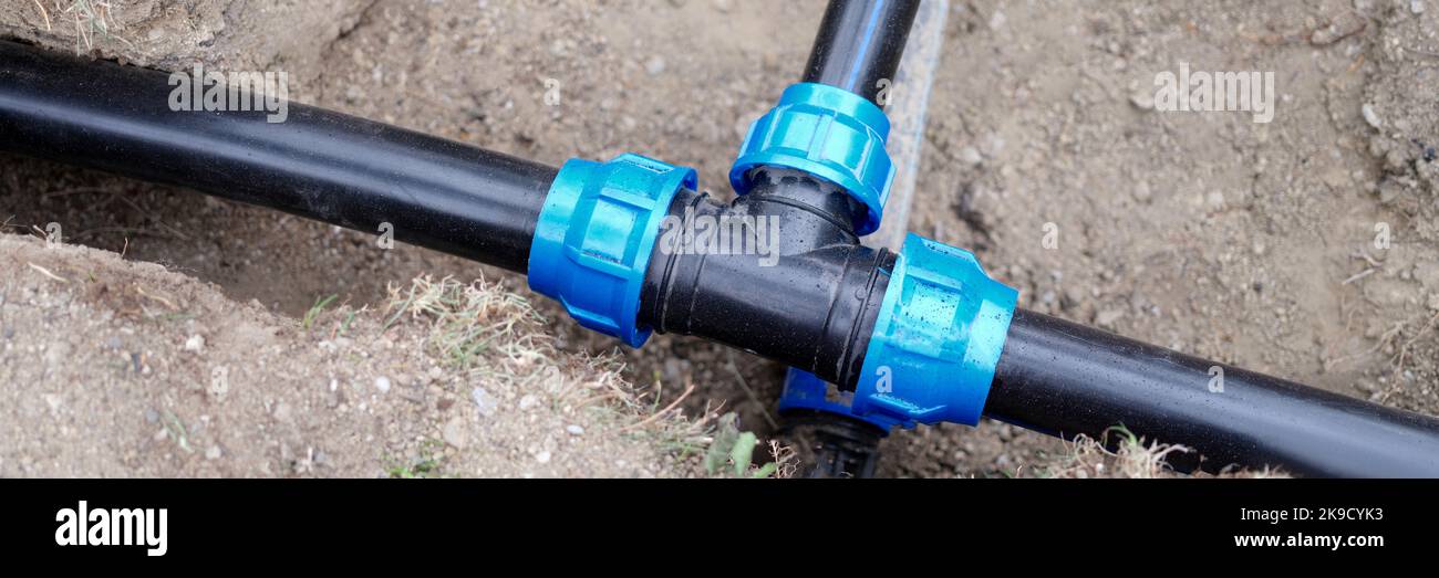 Installed PVC water pipes are assembled and laid in trench at