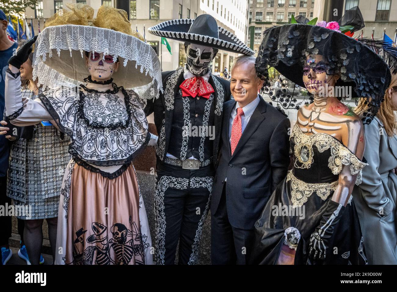 New York, USA. 27th Oct, 2022. Traditional "Catrin" and "Catrinas" characters pose with people