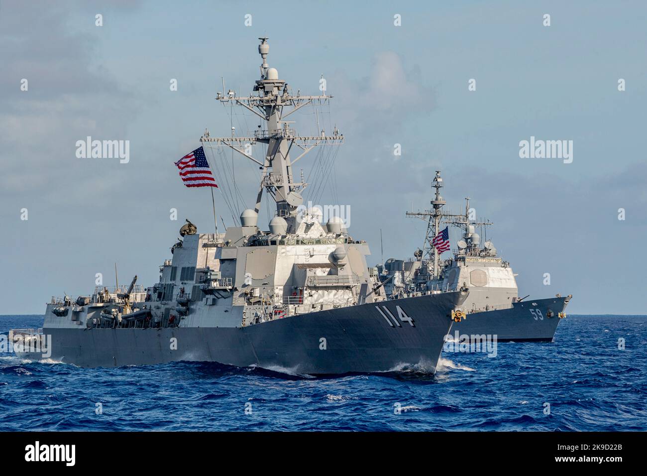The Arleigh Burke-class guided-missile destroyer USS Ralph Johnson (DDG 114) and the Ticonderoga-class guided-missile cruiser USS Princeton (CG 59) U.S. Navy Stock Photo