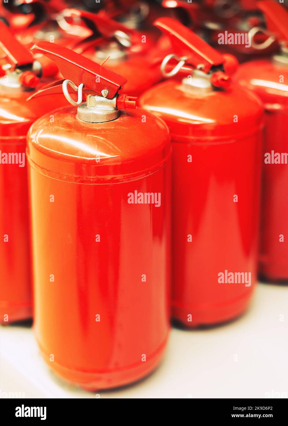 row of the fire extinguishers, on white Stock Photo