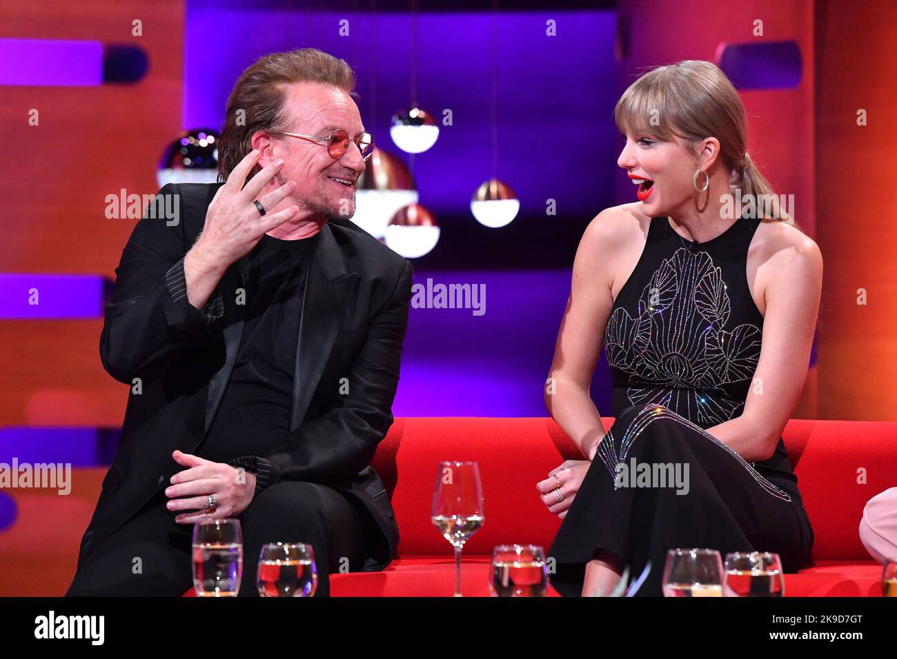 EDITORIAL USE ONLY Bono (left) and Taylor Swift during filming for the Graham Norton Show at BBC Studioworks 6 Television Centre, Wood Lane, London, to be aired on BBC One on Friday evening. Stock Photo