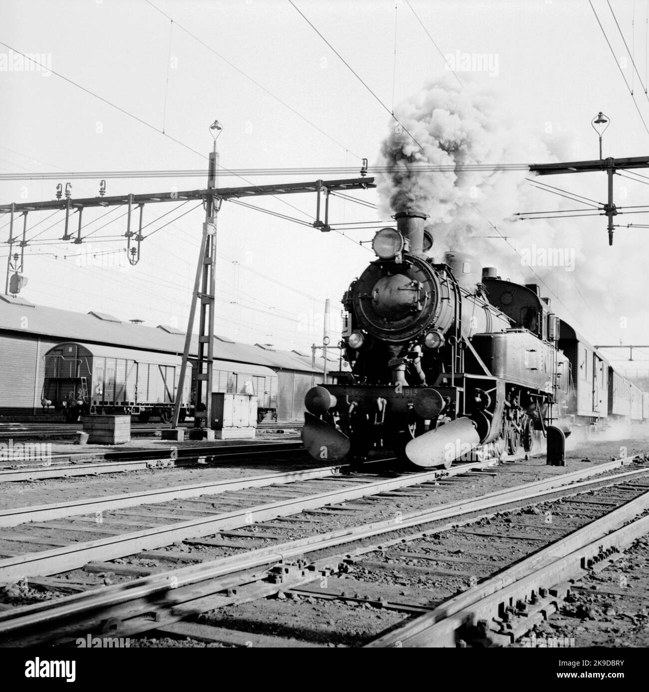 The State Railways, SJ S1 1913 by passenger train against Alvesta Stock ...