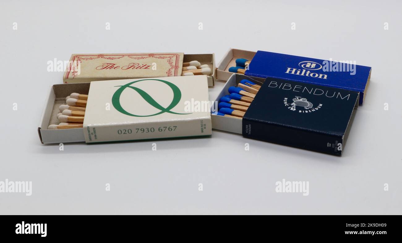 Open boxes of matches from Quaglino's restaurant The Ritz hotel The Hilton hotel and Bibendum restaurant London England UK against a white background Stock Photo