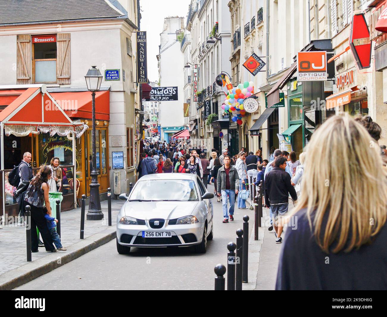 Paris France June 22 2009; busy narrow city street Place St Andre Des