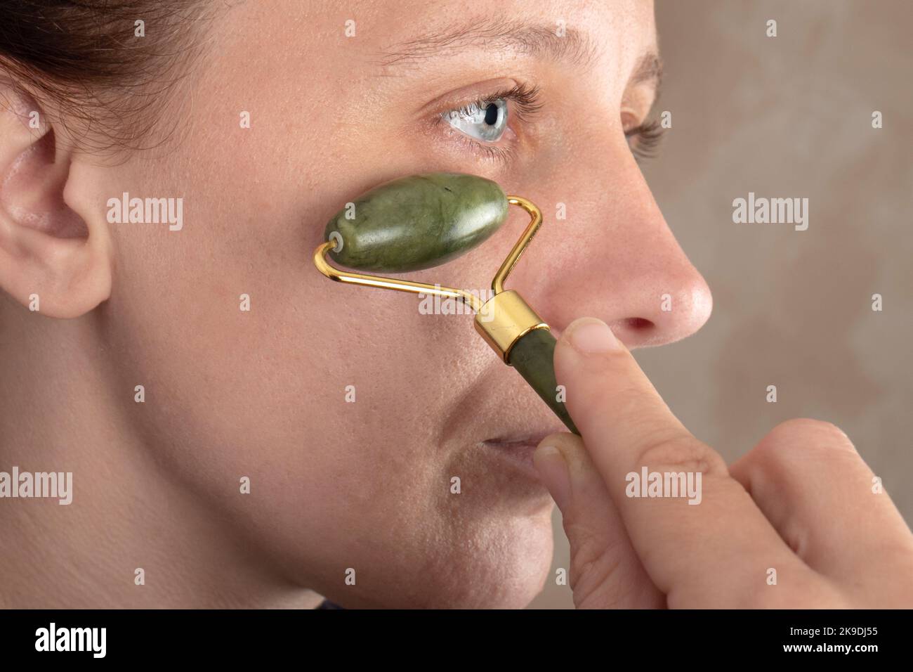 jade stone for woman face care and wrinkle smoothing. Stock Photo