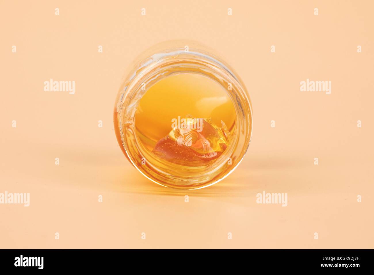 yellow cannabis wax in glass container, golden thc dab Stock Photo Alamy