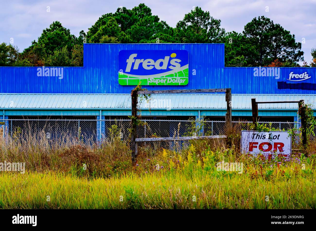 A “For Sale” sign stands in front of Fred’s Super Dollar, Oct. 24, 2022, in Bayou La Batre, Alabama. Stock Photo
