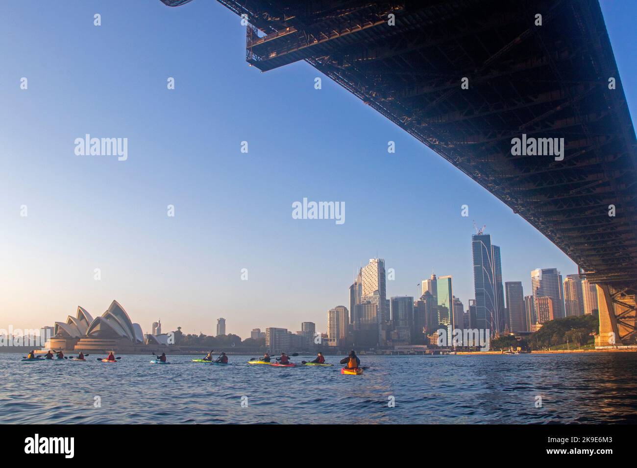 Kayaking beneath the Sydney Harbour Bridge Stock Photo