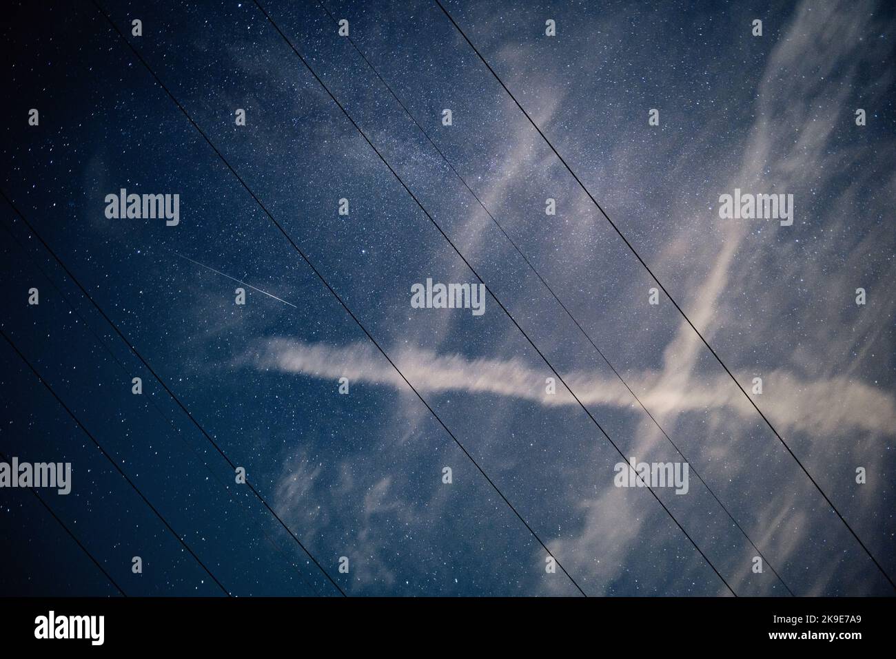 night starry sky with clouds and power line wires Stock Photo - Alamy