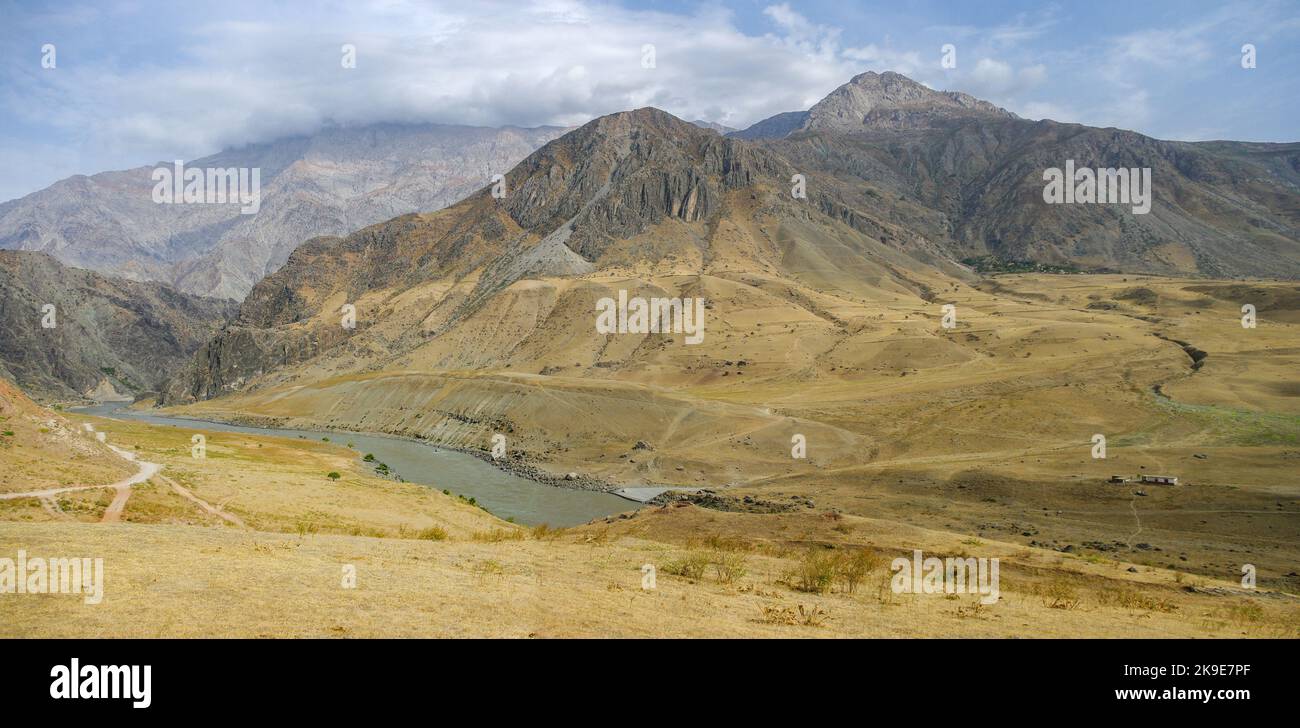 Scenic mountain panoramic view towards Afghanistan in Panj river valley, Darvaz, Gorno-Badakshan, Tajikistan Pamir Stock Photo