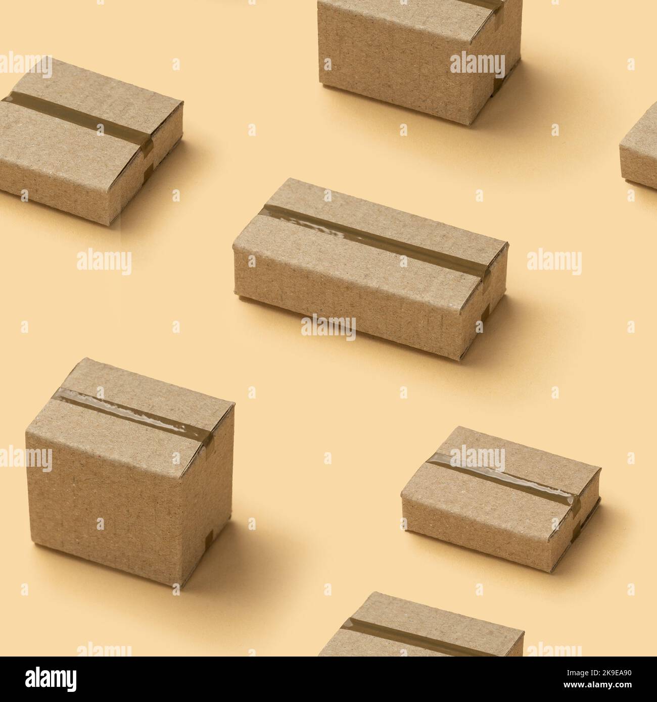 Cardboard boxes seamless pattern texture on brown background. Stock Photo