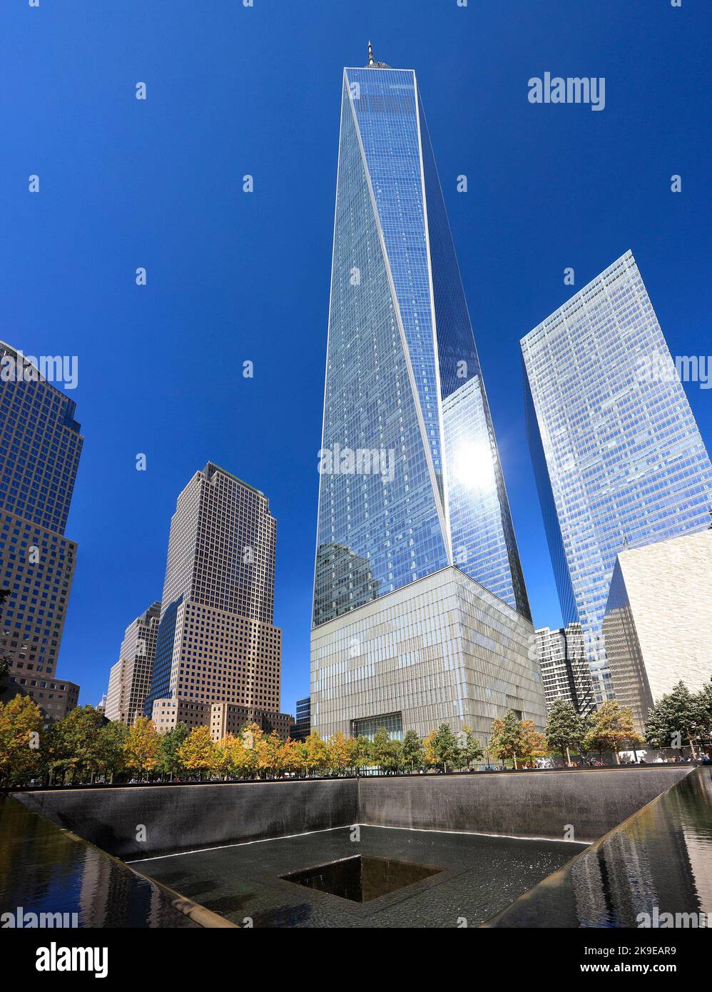 Freedom Tower and Memorial Fountain commemorating the September 11 attacks of 2001, located in lower Manhattan, stands 1,776 feet tall. Stock Photo