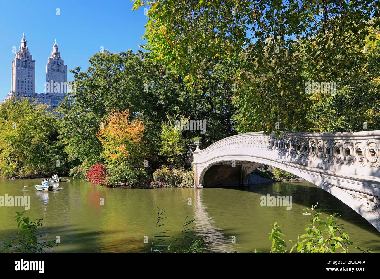 Central Park in foliage autumn colors, including the lake, boats and bridge in New York City, USA Stock Photo