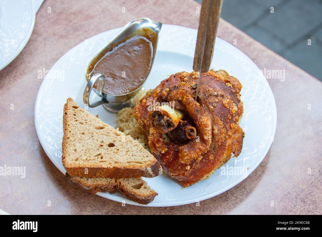 Roasted pork hock with bread and sourkraut at Brauhaus Kloster Machern, Bernkastel-Kues, Germany Stock Photo