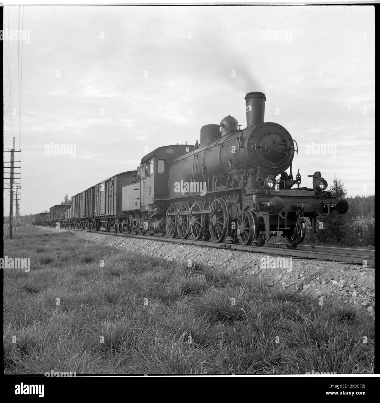 Freight trains drawn by steam locomotive. State Railways, SJ E2 1127 ...