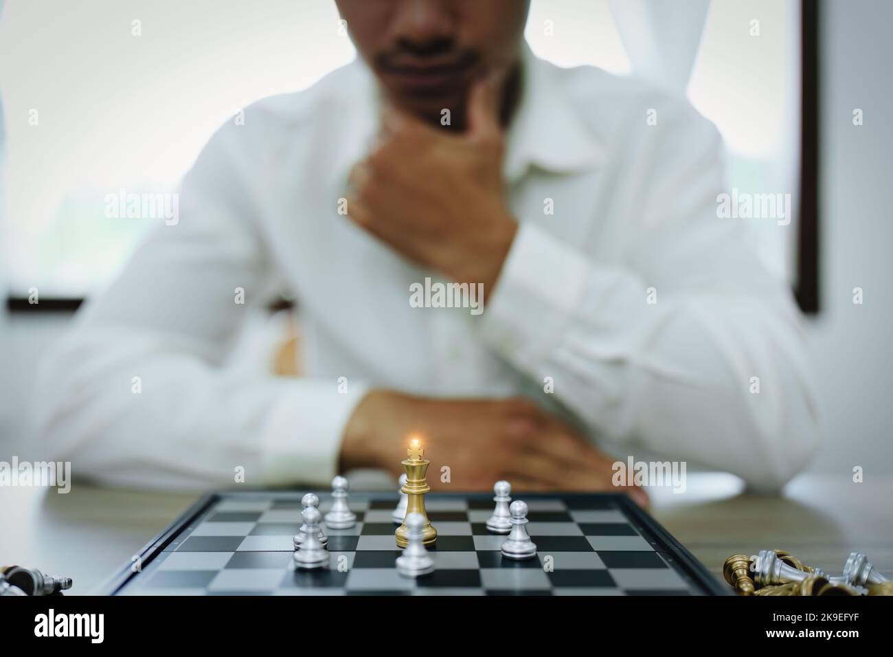 Playing and planning a chess walk, an entrepreneur is planning a business to compete with the competitors in the marketing Stock Photo