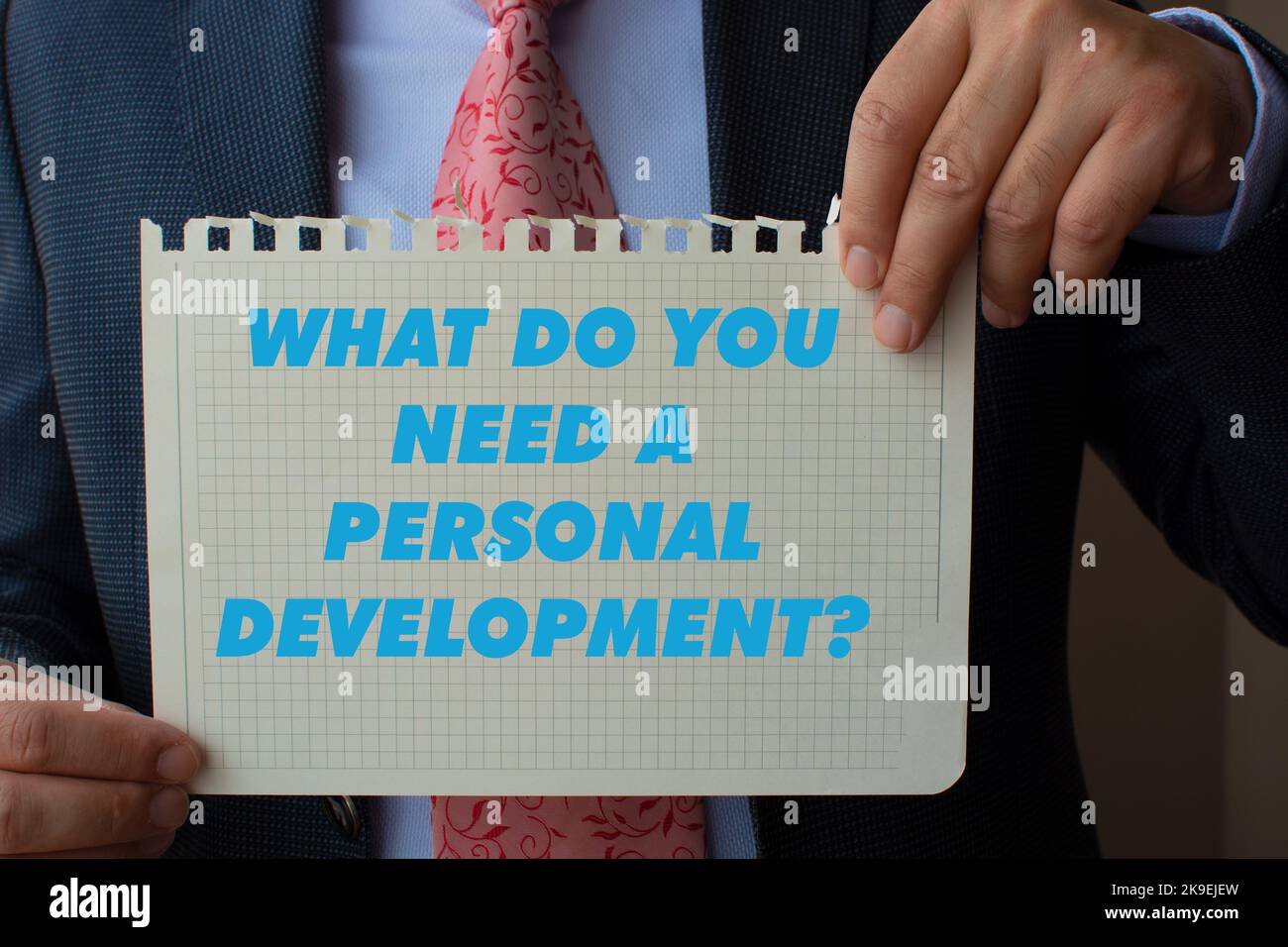 The paper in the suit of the man's hand says what do you need a