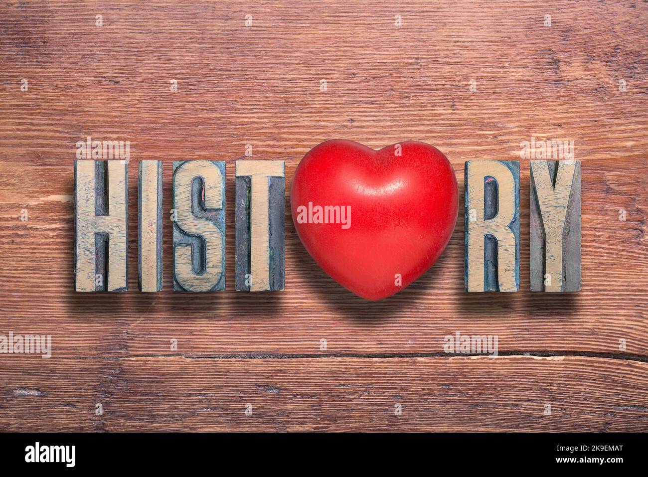 history word combined on vintage varnished wooden surface with heart symbol inside Stock Photo