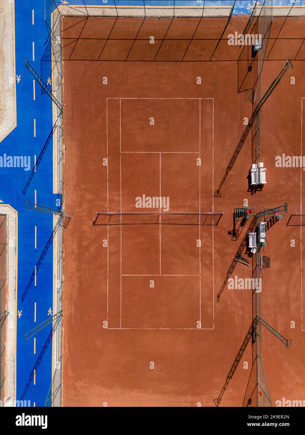 Aerial view of empty clay tennis court on a sunny day Stock Photo