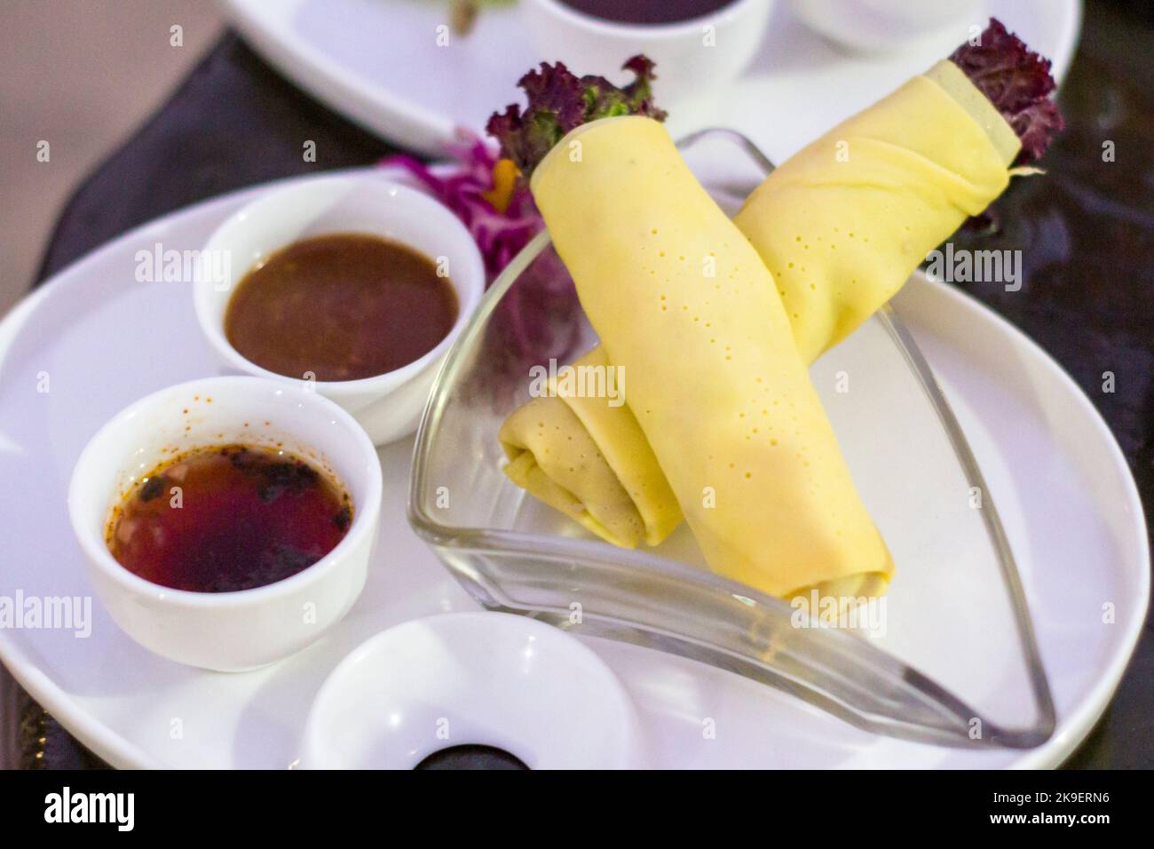 Filipino fresh lumpia with condiments in Manila, Philippines Stock