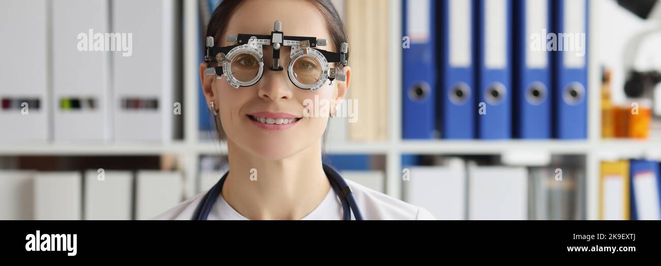 Woman wear optometrist trial frame at ophthalmology clinic, ophthalmologist help select glasses Stock Photo