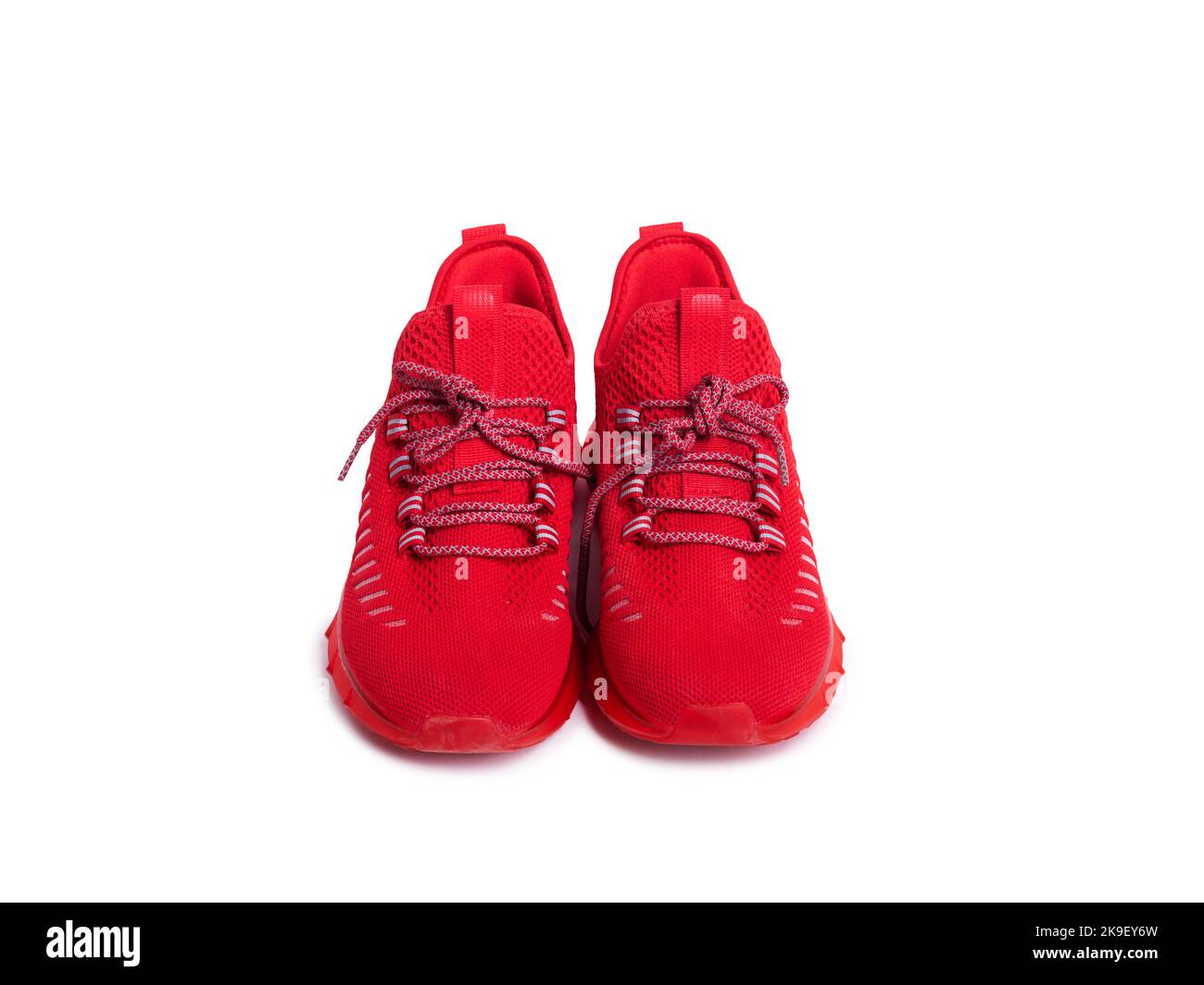 pair of red sneakers on a white isolated background. Sports shoes for running and sports Stock Photo