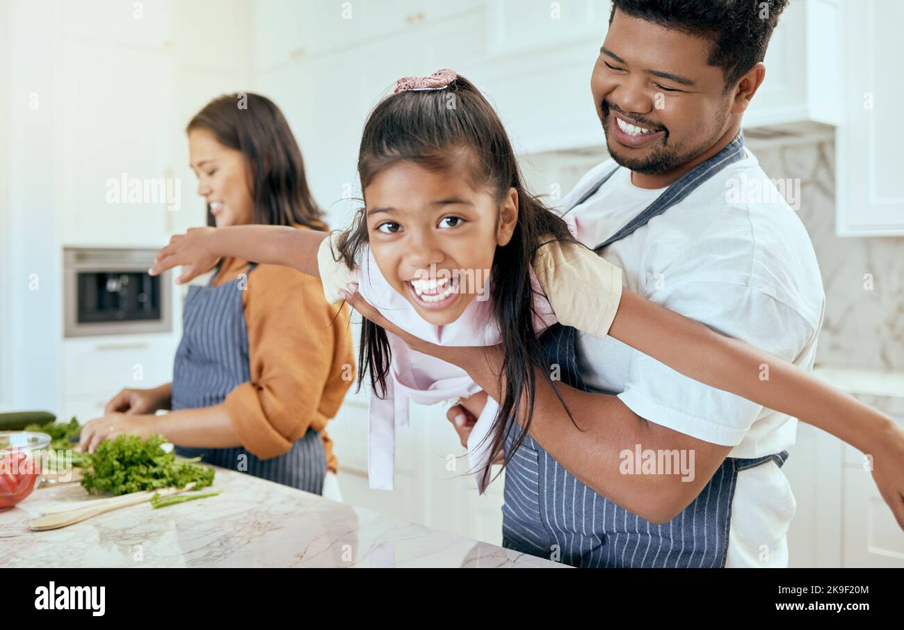 Happy little girl help mom cooking in kitchen Stock Photo - Alamy