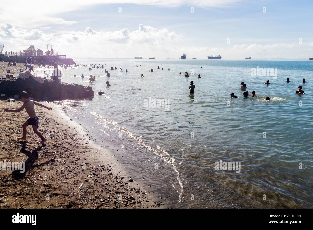Cebuanos taking to the beach on a Sunday morning in Cebu, Philippines Stock Photo