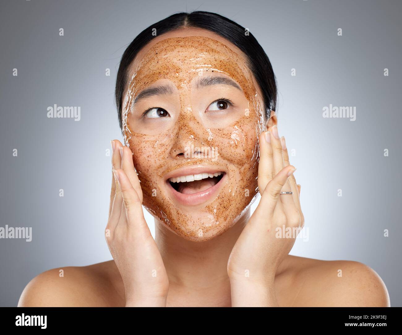 Skincare, exfoliate and asian woman face mask for healthy, smooth and soft skin and happy with cosmetic result. Beauty model with facial cleaning Stock Photo