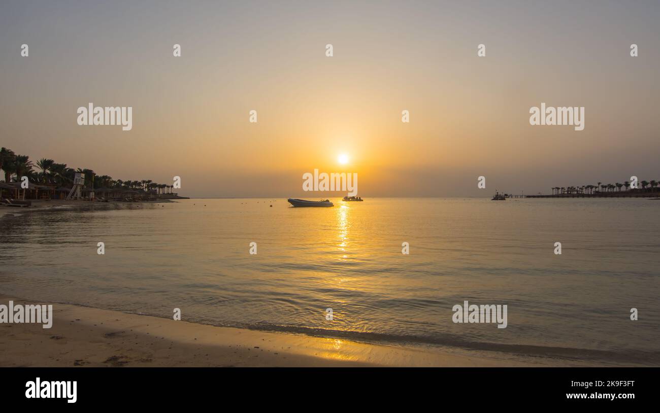 waves at the beach during wam sunset on vacation in egypt Stock Photo