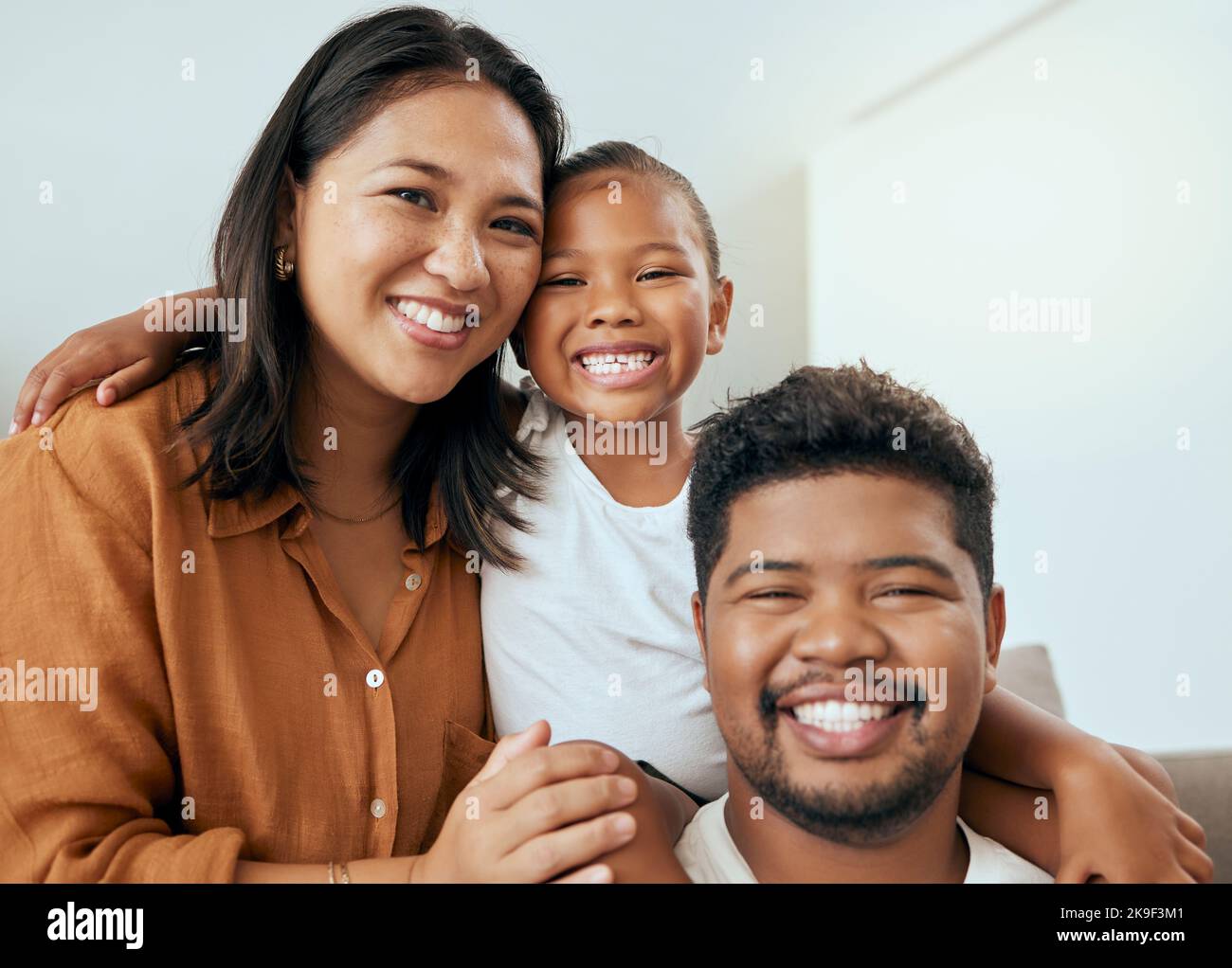 Happy family, mother and father with child in a portrait enjoying ...