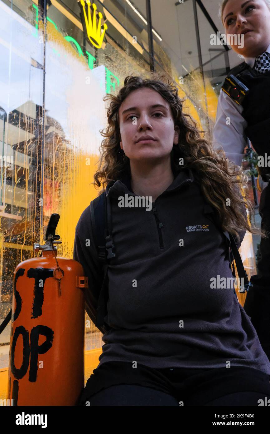 London, UK. 28 OCT 2022. Just Stop Oil spray paints Rolex store in Knightsbridge claiming time is running out. Credit: Joao Daniel Pereira/Alamy Live News Stock Photo