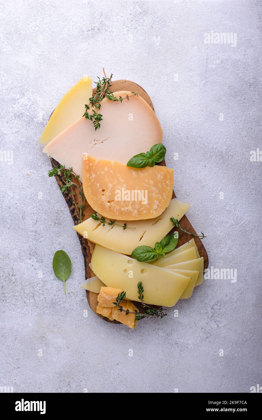 Parmesan, cheddar, gouda and maasdam cheese Stock Photo Alamy